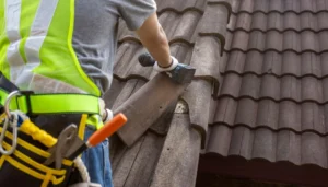 Reliable Roofing Near Me contractor repairing cracked tiles on a Phoenix home before monsoon storms