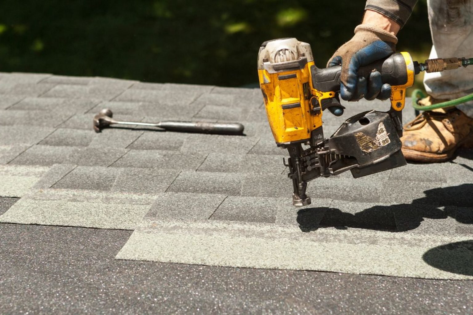 hire a roofer near you inspecting a roof