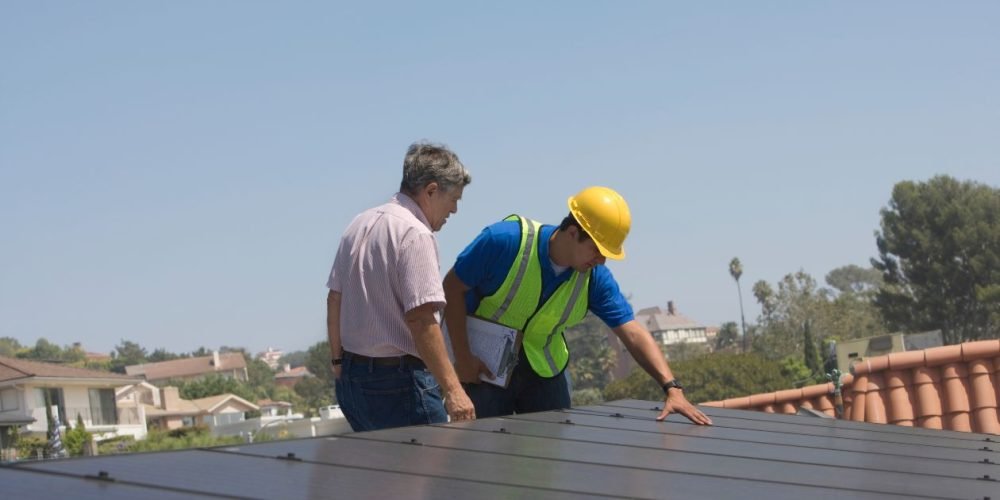 Phoenix roofer replacing cracked tiles during a roof tune-up before monsoon season