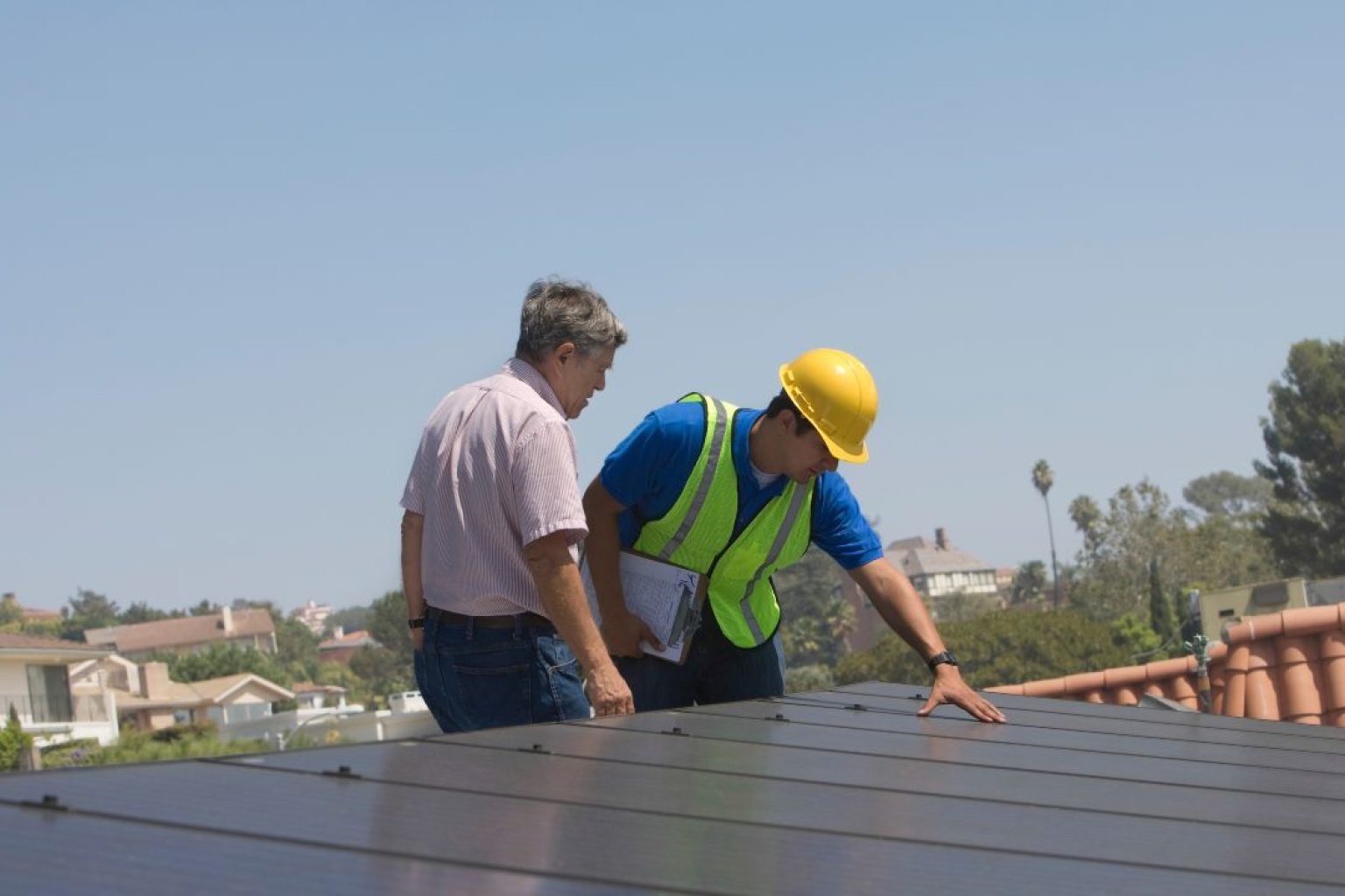 Phoenix roofer replacing cracked tiles during a roof tune-up before monsoon season